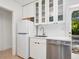 Bright kitchen showcasing white cabinets, stainless steel appliances, and ample counter space at 3629 Almeria Ave, Sarasota, FL 34239