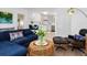 Open-concept living room with a view of the kitchen, modern decor, and comfortable seating at 3629 Almeria Ave, Sarasota, FL 34239