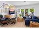 Stylish living room with comfortable sofa, modern media center, and bright natural light at 3629 Almeria Ave, Sarasota, FL 34239