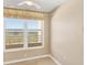 Bedroom features a window that offers a view of greenery and tiled floor at 3750 Pinebrook Circle # Apt 505, Bradenton, FL 34209