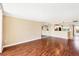 Bright living room with hardwood floors that connects to the kitchen, offering an open and airy layout at 3750 Pinebrook Circle # Apt 505, Bradenton, FL 34209