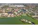 An aerial of a beautiful community with lake views, mature trees, and single-Gathering homes at 3825 Wilshire Cir # 1, Sarasota, FL 34238