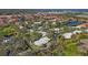 An aerial view of a single-Gathering home surrounded by lush trees, offering privacy and serenity at 3825 Wilshire Cir # 1, Sarasota, FL 34238