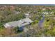 Aerial view of a residential neighborhood showcasing mature trees and well-maintained homes at 3825 Wilshire Cir # 1, Sarasota, FL 34238