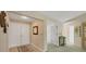 Bright entryway featuring tile flooring, double front doors, and a view into the home at 3825 Wilshire Cir # 1, Sarasota, FL 34238