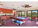 Recreation room with pool table, cabinets, ceiling fans, and sliding glass doors at 3825 Wilshire Cir # 1, Sarasota, FL 34238