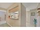 Functional kitchen with a pass-through bar, white appliances, and ample counter space at 3825 Wilshire Cir # 1, Sarasota, FL 34238
