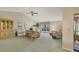 Spacious living room with vaulted ceilings, large windows, and comfortable seating area at 3825 Wilshire Cir # 1, Sarasota, FL 34238