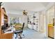 Office with custom bookshelves, desk, and a comfortable seating area with a large window at 3825 Wilshire Cir # 1, Sarasota, FL 34238