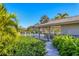 Secluded pool area with a covered pavilion and lush tropical landscaping at 3825 Wilshire Cir # 1, Sarasota, FL 34238