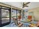 Cozy sunroom with large windows, comfortable seating, and a view of the outdoors at 3825 Wilshire Cir # 1, Sarasota, FL 34238