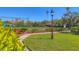 Scenic tennis courts surrounded by lush greenery and landscaping at 3825 Wilshire Cir # 1, Sarasota, FL 34238