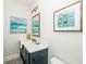 Modern bathroom with a stylish vanity, a decorative mirror, and elegant decor at 401 20Th Pl, Bradenton Beach, FL 34217