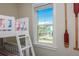 Bedroom with a window featuring tropical waterfront views with a dock and palm trees at 401 20Th Pl, Bradenton Beach, FL 34217