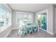 Charming dining area features a large table set for eight, with plenty of natural light and a sliding door at 401 20Th Pl, Bradenton Beach, FL 34217