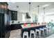 Modern kitchen with stainless steel appliances, a spacious island, and bar stool seating at 401 20Th Pl, Bradenton Beach, FL 34217