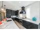 Modern kitchen with stainless steel appliances, sleek countertops, and stylish pendant lighting at 401 20Th Pl, Bradenton Beach, FL 34217