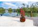 Dock with boat lift featuring a beautiful potted plant and tranquil water views at 4205 Higel Ave, Sarasota, FL 34242