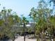 Beautiful home exterior, surrounded by tropical palms, offers scenic ocean views at 4205 Higel Ave, Sarasota, FL 34242