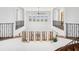 Bright open foyer with detailed iron railings, light walls, and multiple windows providing beautiful views at 4205 Higel Ave, Sarasota, FL 34242