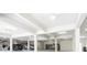 Spacious garage with ample parking, storage, and lighting for car enthusiasts at 4205 Higel Ave, Sarasota, FL 34242