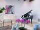 Stylish living area with a piano, artwork, zebra rug, and plush seating at 4205 Higel Ave, Sarasota, FL 34242