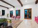Comfortable room featuring exposed beams, colorful accents, and natural light at 4205 Higel Ave, Sarasota, FL 34242