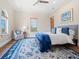 This main bedroom features a ceiling fan, windows and a sitting area at 4205 Higel Ave, Sarasota, FL 34242