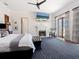 Spacious main bedroom boasts fireplace, patterned rug, and balcony access at 4205 Higel Ave, Sarasota, FL 34242