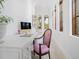 Bright office space with detailed white desk, stylish chair and arched windows at 4205 Higel Ave, Sarasota, FL 34242