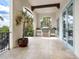 Outdoor kitchen featuring a grill, stainless steel cabinets, and tile flooring at 4205 Higel Ave, Sarasota, FL 34242
