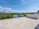 Expansive rooftop patio with tiled flooring and scenic views of the water at 4205 Higel Ave, Sarasota, FL 34242