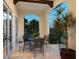 Charming patio area with dining table and serene outdoor scenery at 4205 Higel Ave, Sarasota, FL 34242