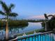 Beautiful swimming pool with lush greenery and stunning waterfront views at 4205 Higel Ave, Sarasota, FL 34242