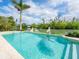 Inviting waterfront pool with pristine turquoise water and relaxing tropical scenery at 4205 Higel Ave, Sarasota, FL 34242