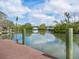 Picture-perfect waterfront view from the wooden dock and lush trees at 4205 Higel Ave, Sarasota, FL 34242