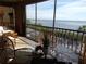 Relaxing balcony with comfortable seating and stunning water views in background at 4555 Bay Club Dr # 22, Bradenton, FL 34210