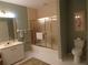 Well-lit bathroom featuring a tub with a shower, vanity, and neutral color palette at 4555 Bay Club Dr # 22, Bradenton, FL 34210