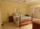 Inviting bedroom boasts a wooden sleigh bed and warm, neutral tones at 4555 Bay Club Dr # 22, Bradenton, FL 34210