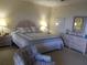 Bedroom with a bed, chair, and dresser with a mirror at 4555 Bay Club Dr # 22, Bradenton, FL 34210