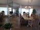 Dining room with a chandelier, plants, natural light, and large mirror at 4555 Bay Club Dr # 22, Bradenton, FL 34210
