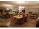 Elegant dining room with chandelier, large mirror and tiled floor at 4555 Bay Club Dr # 22, Bradenton, FL 34210