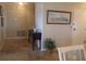 Inviting entryway featuring tiled flooring, a wooden accent table, and neutral wall paint at 4555 Bay Club Dr # 22, Bradenton, FL 34210