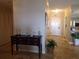 Foyer featuring tile flooring, coat closet and wooden console table at 4555 Bay Club Dr # 22, Bradenton, FL 34210