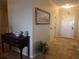 Hallway featuring tile flooring, a dark wood table, white trim, and neutral paint at 4555 Bay Club Dr # 22, Bradenton, FL 34210