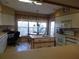 Bright eat-in kitchen with white cabinetry, island and stainless steel appliances at 4555 Bay Club Dr # 22, Bradenton, FL 34210
