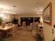 Living area featuring tile floors, a fireplace, large windows, and ample seating at 4555 Bay Club Dr # 22, Bradenton, FL 34210