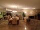 Open-concept living and dining area with tile floors, a fireplace, and natural light at 4555 Bay Club Dr # 22, Bradenton, FL 34210
