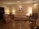 Inviting living room with tile floors, a comfortable sofa, lamps, and tasteful decor at 4555 Bay Club Dr # 22, Bradenton, FL 34210