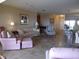 Comfortable living room with tile floors, plush seating, and views into the dining area at 4555 Bay Club Dr # 22, Bradenton, FL 34210